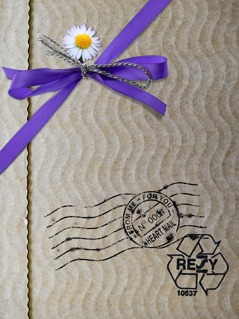 package with blue ribbon and flower. Describing responsible packaging.
